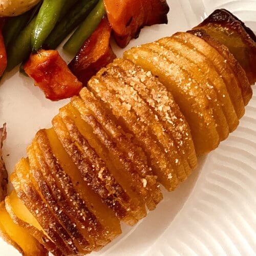 Golden, crispy Hasselback potato, baked to perfection with a buttery, breadcrumb topping.