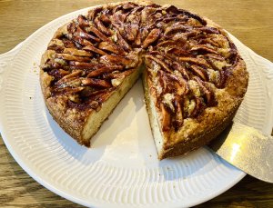 Slice cut from Finnish apple cake showing moist interior with apples and spices
