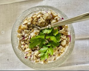 Creamy Finnish wild mushroom salad garnished with fresh parsley.