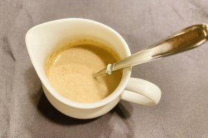 Apple and Dijon-based Christmas ham sauce in a saucer.