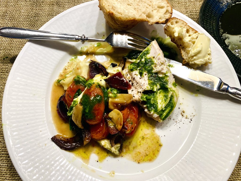 Boiled chicken breast served with roasted cherry tomatoes with basil oil and fresh crusty bread with butter.