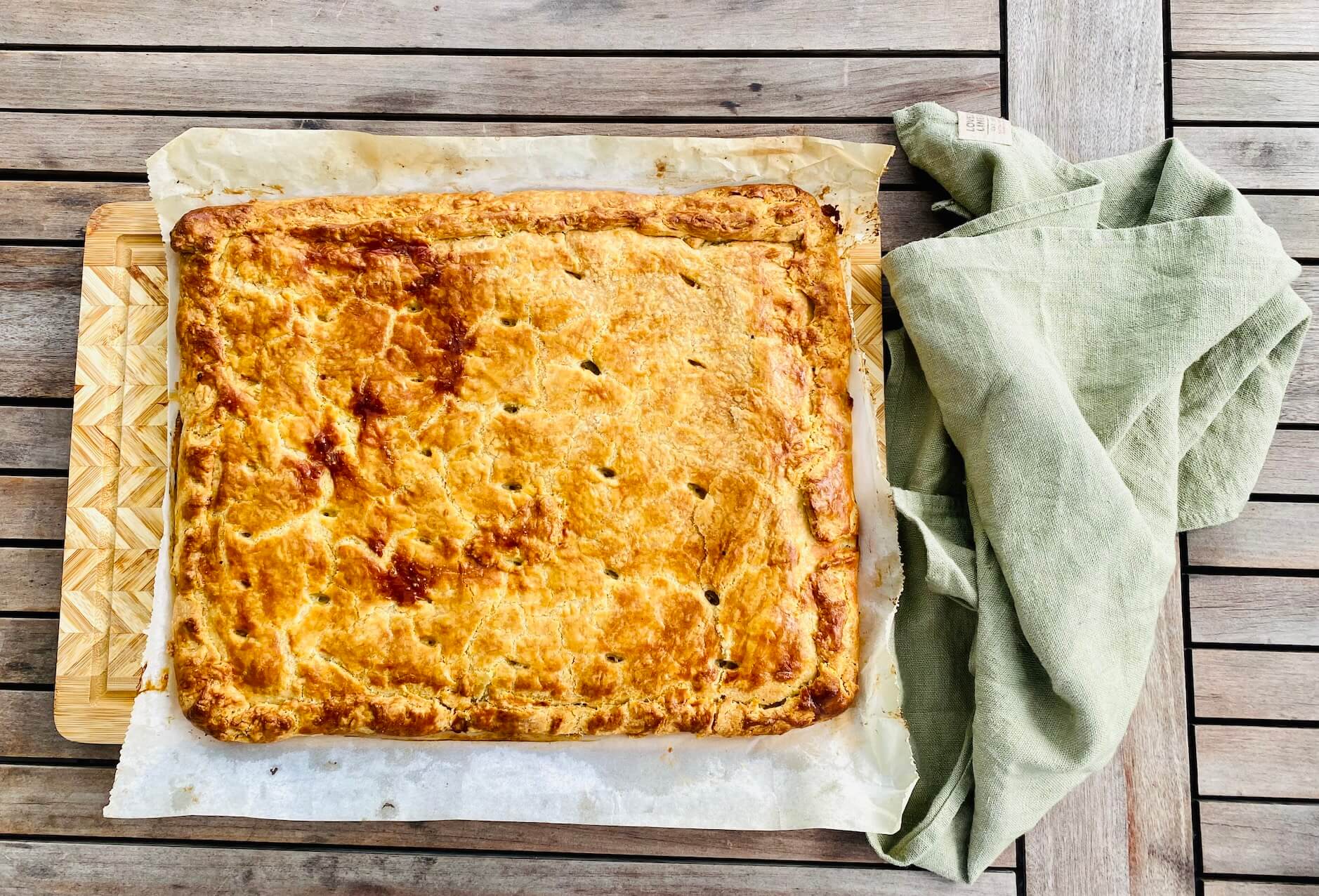Finnish cabbage pie baked on an oven tray.