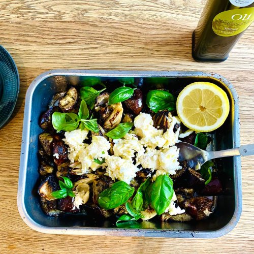 Grilled eggplant with mozzarella, basil, onions, and garlic in a grilling dish