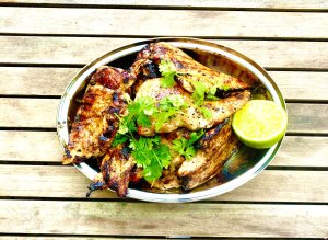Grilled chicken fillets with tare sauce, cilantro, and lime
