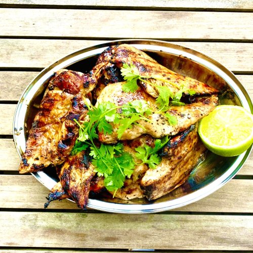 Grilled chicken fillets with tare sauce, cilantro, and lime