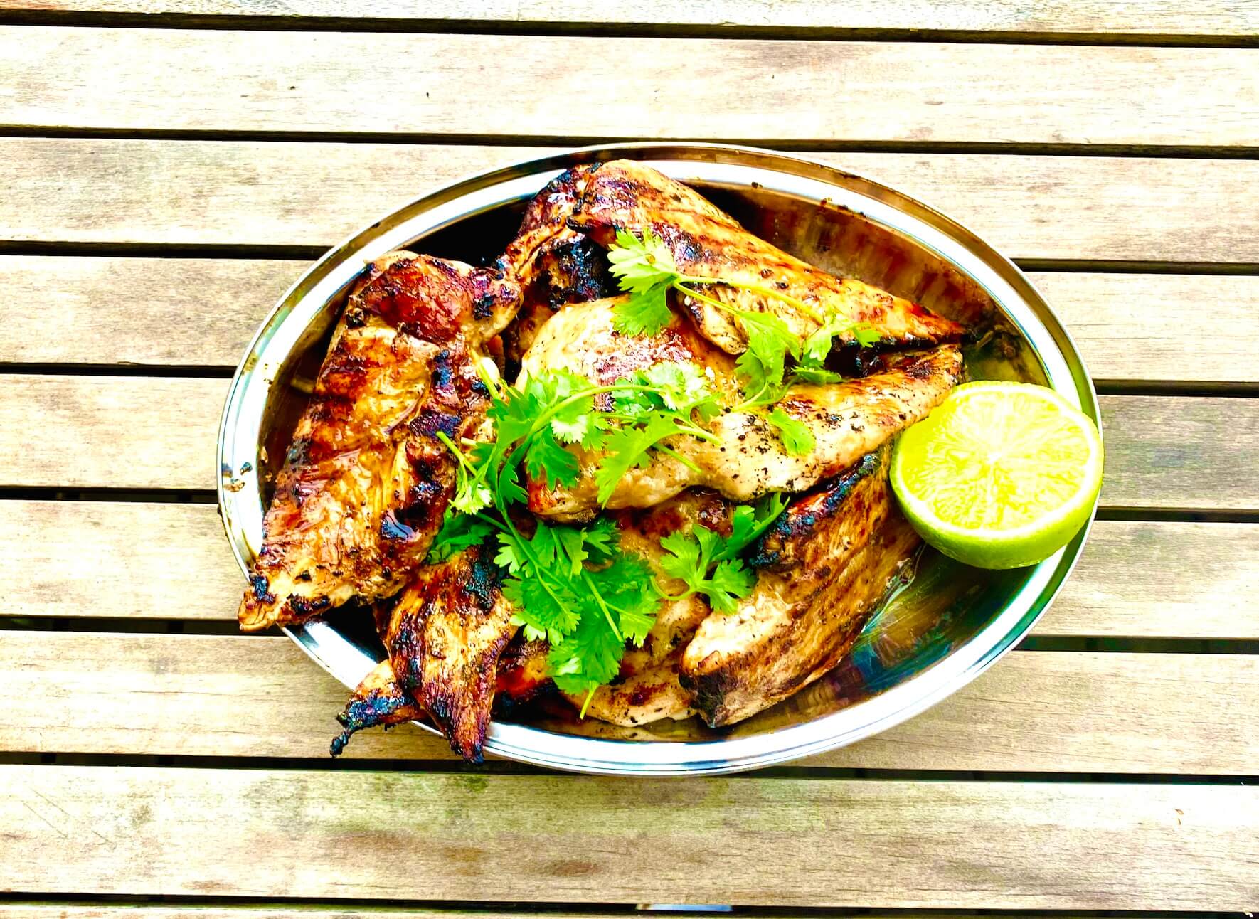 Grilled chicken fillets with tare sauce, cilantro, and lime