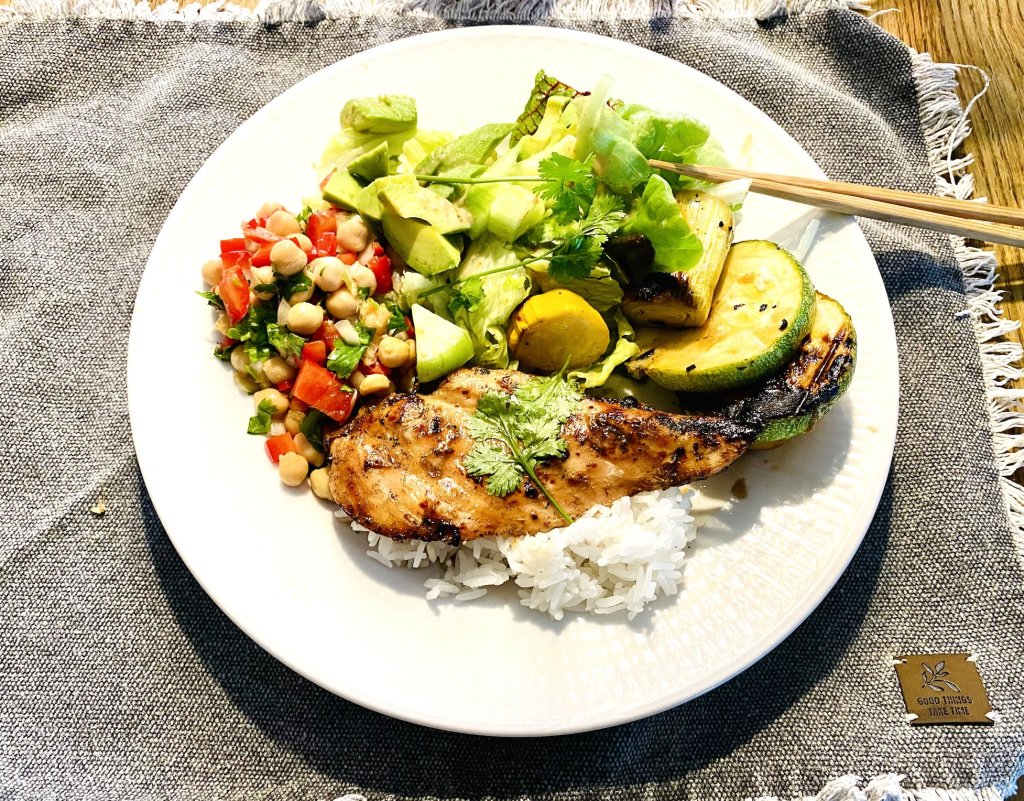 Grilled chicken with tare sauce, jasmine rice, chickpea salad, and grilled vegetables